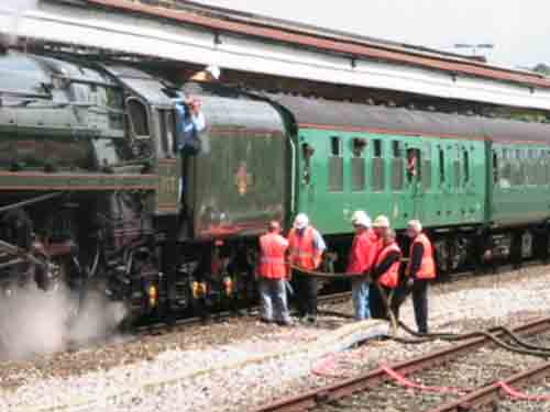 
Fig 2 - Watering a steam loco in the platforms